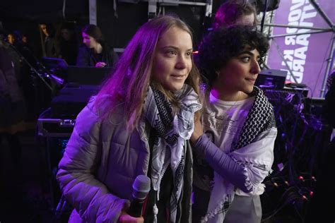 Greta Thunberg brushes off interruption at massive Dutch climate march days before election